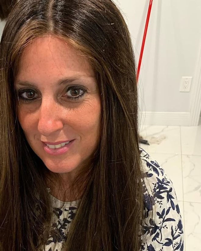 Long, straight lace top wig with a natural part